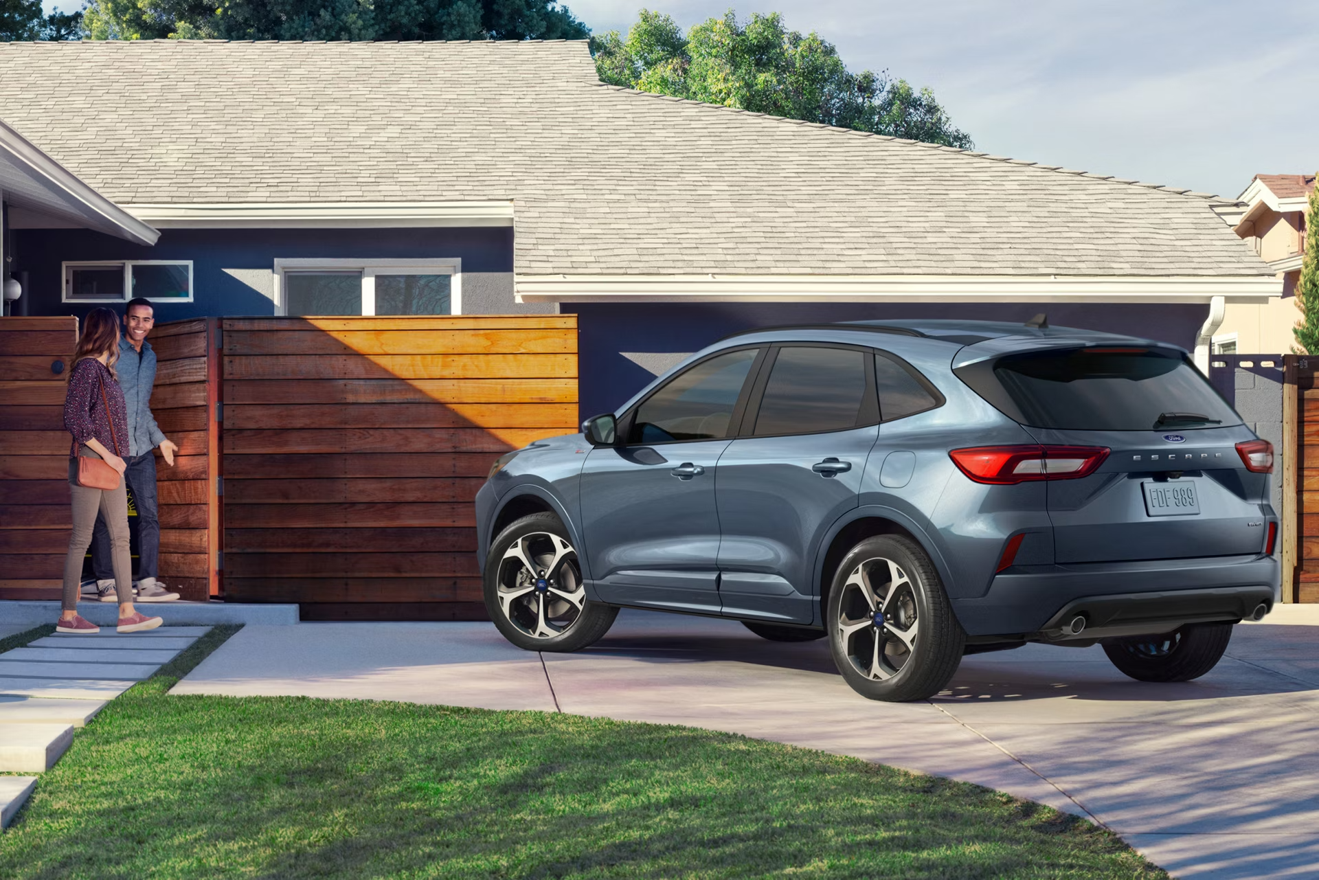 Ford SUV parked in front of a modern home in Lakewest.